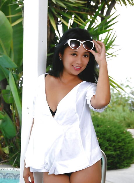 Svelte asian milf Lucky Starr exposes small tits and masturbates at pool